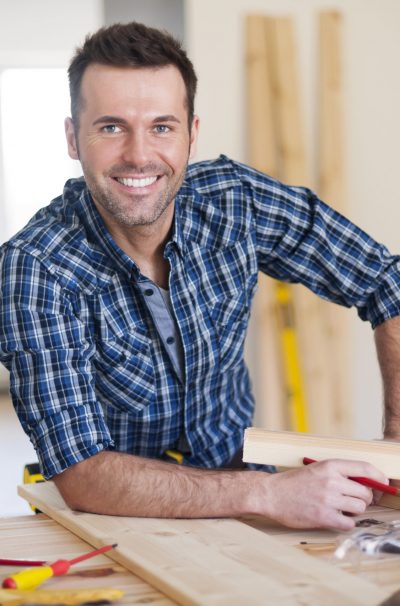 Smiling business owner worker at work
